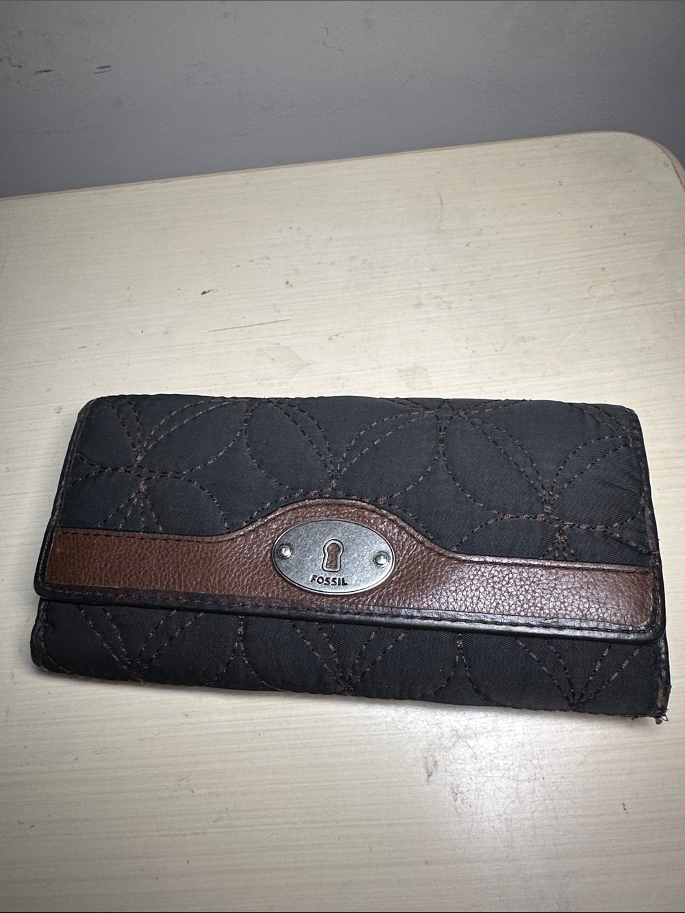 Fossil Key Per Black Quilted Wallet with Brown Trim and red interior